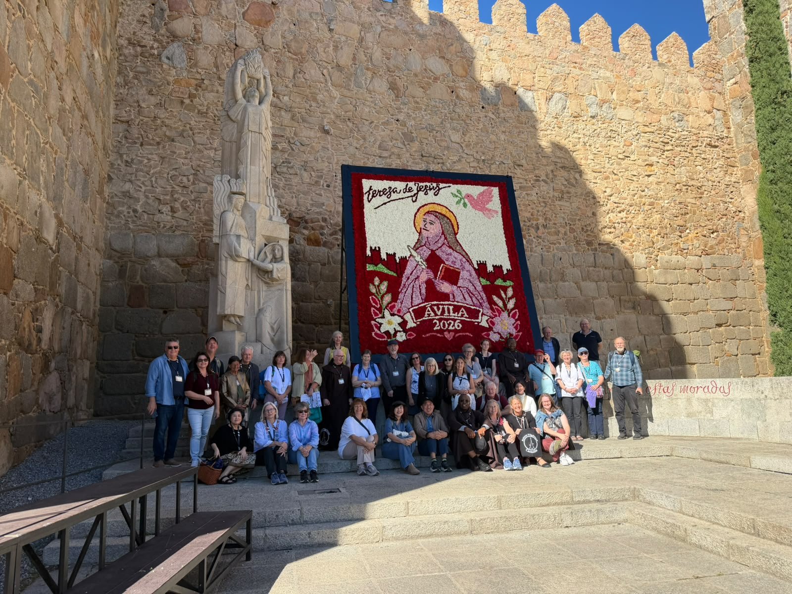 Before the flower portrait of St Teresa at the walls of Ávila